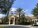The exterior of the community clubhouse showcasing palm trees and landscaping at 728 Greybull Run, Lake Mary, FL 32746