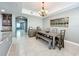 Charming dining room with rustic furniture and access to other areas at 728 Greybull Run, Lake Mary, FL 32746