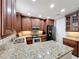 Spacious kitchen with granite counters, stainless appliances, and a functional island at 728 Greybull Run, Lake Mary, FL 32746