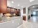 Lovely kitchen with granite counters, stainless appliances, and wood cabinets at 728 Greybull Run, Lake Mary, FL 32746