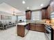 Modern kitchen adjacent to the dining area, showcasing an open-concept living space at 728 Greybull Run, Lake Mary, FL 32746