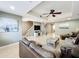 Comfortable living room with tile floors, staircase, media center, and access to multiple areas at 728 Greybull Run, Lake Mary, FL 32746