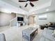 Inviting living room with tile floors, a large television, and plenty of room for entertaining and relaxation at 728 Greybull Run, Lake Mary, FL 32746