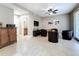 Spacious living room featuring neutral walls, tile floors, a ceiling fan, and a TV at 728 Greybull Run, Lake Mary, FL 32746