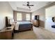 This main bedroom features neutral paint, carpeting, natural light, and en-suite bath and walk-in closet at 728 Greybull Run, Lake Mary, FL 32746