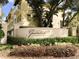 The 'Grande Oaks at Heathrow' community signage featuring beautiful landscaping at 728 Greybull Run, Lake Mary, FL 32746