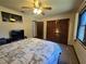 Bedroom with a large window, a ceiling fan, and patterned bed coverings at 1016 Monroe Ave, St Cloud, FL 34769