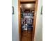 Walk-in closet featuring hardwood floors, ample hanging space and shelving for maximum storage at 1016 Monroe Ave, St Cloud, FL 34769