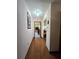 Hallway with hardwood floors leading to living areas for easy navigation throughout the home at 1016 Monroe Ave, St Cloud, FL 34769