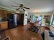 Open concept kitchen and dining area with hardwood floors and plenty of natural light at 1016 Monroe Ave, St Cloud, FL 34769