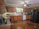 Functional kitchen featuring wood cabinetry, ample counter space, and modern appliances at 1016 Monroe Ave, St Cloud, FL 34769
