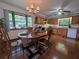 Spacious kitchen and dining area with abundant natural light and wood cabinetry at 1016 Monroe Ave, St Cloud, FL 34769