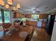 Cozy kitchen with wood cabinets, modern appliances, and an adjacent dining area at 1016 Monroe Ave, St Cloud, FL 34769