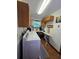 Functional laundry room with natural light, cabinets, and modern appliances at 1016 Monroe Ave, St Cloud, FL 34769