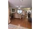 Bright living room with hardwood floors, ceiling fan, and sliding glass doors to enjoy indoor-outdoor living at 1016 Monroe Ave, St Cloud, FL 34769