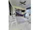 Comfortable enclosed sunroom with a hammock and tile flooring at 1016 Monroe Ave, St Cloud, FL 34769