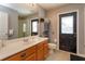 Neutral bathroom with a spacious vanity and a shower with glass doors at 11314 Ledgement Ln, Windermere, FL 34786