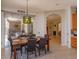 Open dining area with designer lighting and view to outdoor living space at 11314 Ledgement Ln, Windermere, FL 34786