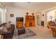 Spacious living area with a comfortable sofa, tile floors, custom built-ins, and a pool table for entertainment at 11314 Ledgement Ln, Windermere, FL 34786