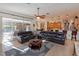 Open concept living room with bar seating, kitchen, and sliding glass door at 11314 Ledgement Ln, Windermere, FL 34786