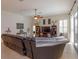 Comfortable living room with tile floors, ceiling fan, and views to the exterior at 11314 Ledgement Ln, Windermere, FL 34786