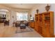 Cozy living room with tile flooring, a comfortable sofa, large windows, and a custom built-in bar area at 11314 Ledgement Ln, Windermere, FL 34786