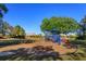 Community playground with swings, slides, and seesaw surrounded by lush landscaping and a safe, soft surface at 11314 Ledgement Ln, Windermere, FL 34786