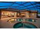 Inviting covered pool area with comfortable seating and an outdoor dining space, perfect for entertaining at 11314 Ledgement Ln, Windermere, FL 34786