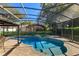 A backyard featuring an enclosed pool, hot tub, patio, and lawn at 11314 Ledgement Ln, Windermere, FL 34786