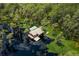 Lake house offering direct water access surrounded by the natural beauty of a cypress forest at 11450 Nellie Oaks Bnd, Clermont, FL 34711