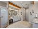 Bathroom with tiled floor, double vanity and glass enclosed shower at 11450 Nellie Oaks Bnd, Clermont, FL 34711