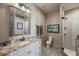 Bathroom features a single vanity with granite countertop, and tile surround shower at 11450 Nellie Oaks Bnd, Clermont, FL 34711