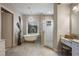 Bathroom featuring a soaking tub, glass enclosed shower, and granite vanity at 11450 Nellie Oaks Bnd, Clermont, FL 34711