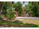 Elegant brick and wrought iron gated entrance, marking the access to a private and secure estate at 11450 Nellie Oaks Bnd, Clermont, FL 34711