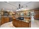 Gourmet kitchen with granite countertops and stainless steel appliances at 11450 Nellie Oaks Bnd, Clermont, FL 34711