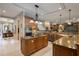 Gourmet kitchen features center island, tiled backsplash, and stainless appliances at 11450 Nellie Oaks Bnd, Clermont, FL 34711