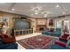 Home theater/living room with custom entertainment center, brick fireplace and cozy seating at 11450 Nellie Oaks Bnd, Clermont, FL 34711