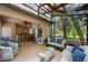 Cozy sun room with lounge seating, kitchenette, tile floors and ceiling fan at 11450 Nellie Oaks Bnd, Clermont, FL 34711