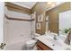 Bathroom features tub and shower combo and a white vanity at 11720 Indian Hills Ln, Clermont, FL 34711
