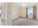 This is a cozy bedroom with neutral tones and a ceiling fan for added comfort at 11720 Indian Hills Ln, Clermont, FL 34711