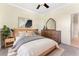 Well-lit bedroom featuring neutral tones, stylish decor, and comfortable furnishings at 11720 Indian Hills Ln, Clermont, FL 34711