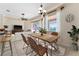 Dining room with modern chandelier and large window to backyard pool at 11720 Indian Hills Ln, Clermont, FL 34711