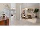 Open dining area featuring neutral tile flooring and chandelier at 11720 Indian Hills Ln, Clermont, FL 34711