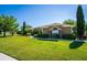 A beautiful single-Gathering home with lush landscaping, a well-manicured lawn and architectural stone accents at 11720 Indian Hills Ln, Clermont, FL 34711