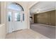 Elegant foyer featuring a study room with large windows, offering a bright and welcoming entrance at 11720 Indian Hills Ln, Clermont, FL 34711