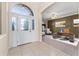 Elegant foyer featuring a study room with large windows, offering a bright and welcoming entrance at 11720 Indian Hills Ln, Clermont, FL 34711