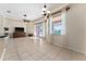 Living room with tile floor and sliding glass doors to outside view at 11720 Indian Hills Ln, Clermont, FL 34711