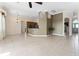 Bright open-concept living room with tile flooring and neutral paint at 11720 Indian Hills Ln, Clermont, FL 34711