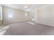 Spacious living room with high ceilings, two windows, and a ceiling fan at 11720 Indian Hills Ln, Clermont, FL 34711
