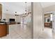 Open living area with tile flooring and access to the backyard at 11720 Indian Hills Ln, Clermont, FL 34711